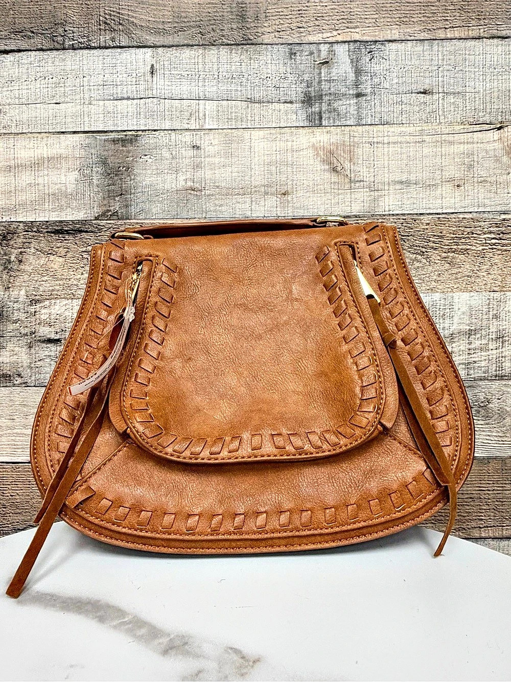 Urban Expressions brown leather crossbody saddle bag